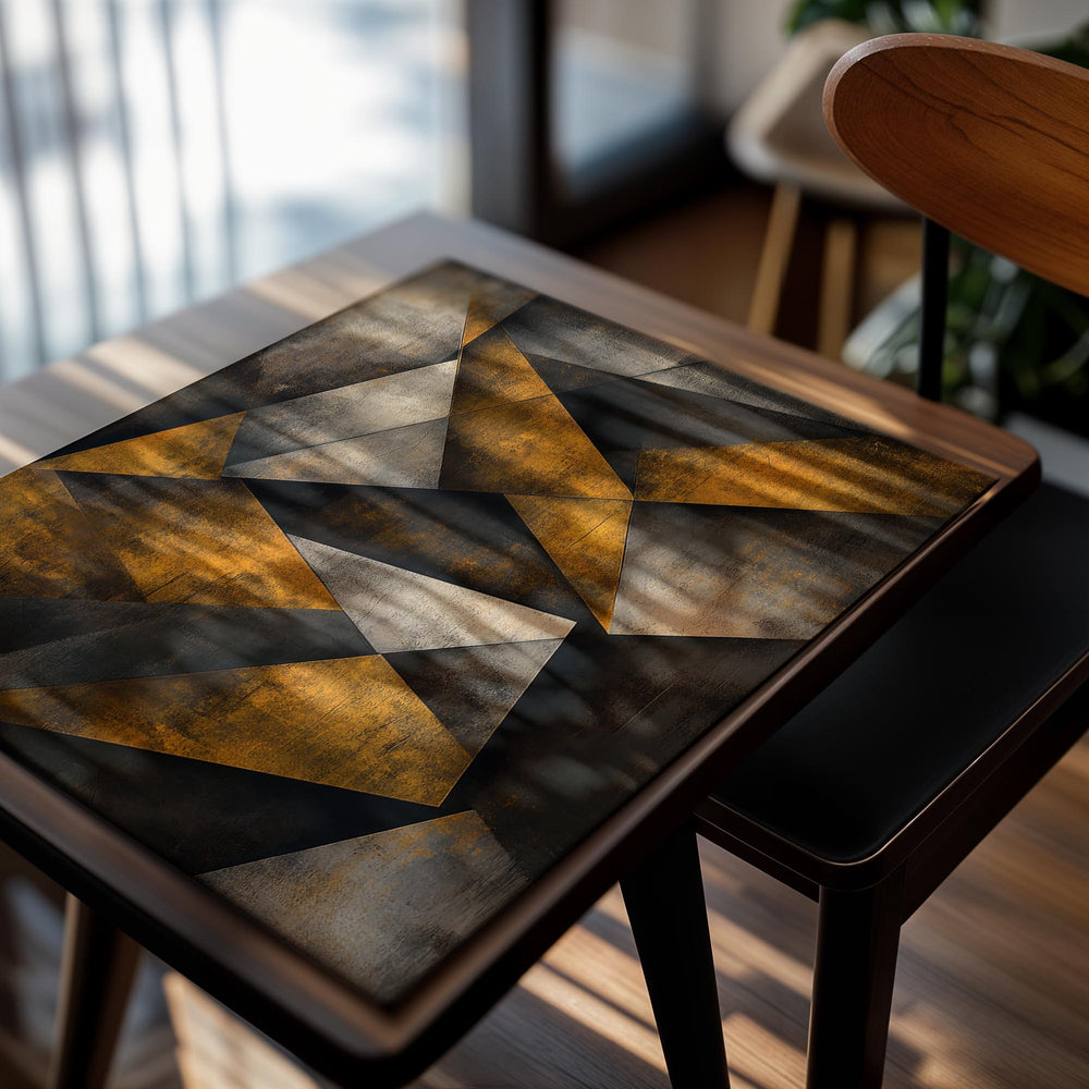 Abstract geometric art piece with triangles in gold, black, and gray on a textured background, as a premium aluminum metal print from GoMetalPrint.
