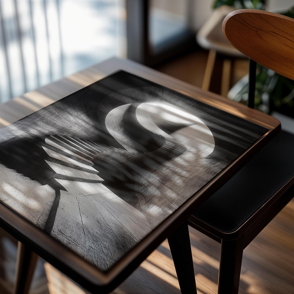 Black and white spiral staircase in a tunnel-like structure, as a premium aluminum metal print from GoMetalPrint.
