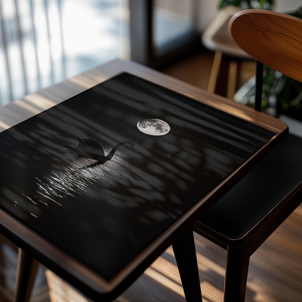 Silhouette of a swan on water with a full moon in the background, as a premium aluminum metal print from GoMetalPrint.

