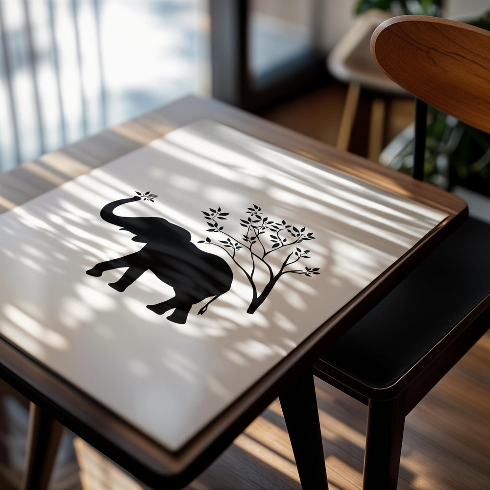 Black silhouette of an elephant holding a branch on a white background, as a premium aluminum metal print from GoMetalPrint.
