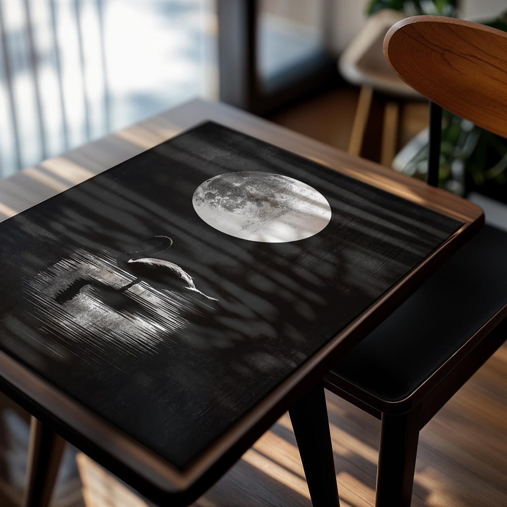 Silhouette of a swan on water with a large moon in the sky, as a premium aluminum metal print from GoMetalPrint.
