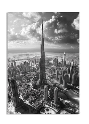 Black and white cityscape with a tall tower against a cloudy sky, as a premium aluminum metal print from GoMetalPrint.
