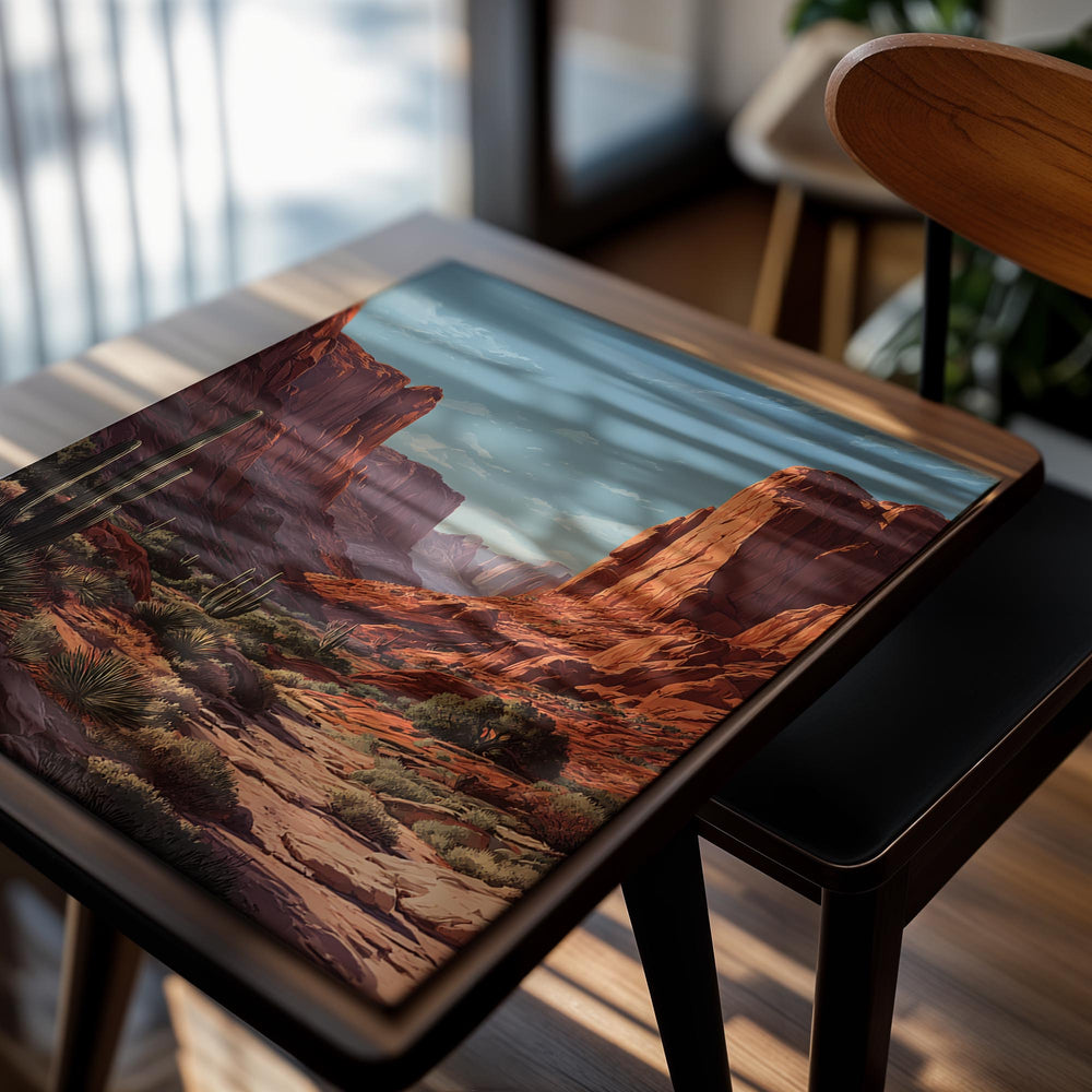 Desert landscape with red rock formations and cacti under a blue sky, as a premium aluminum metal print from GoMetalPrint.
