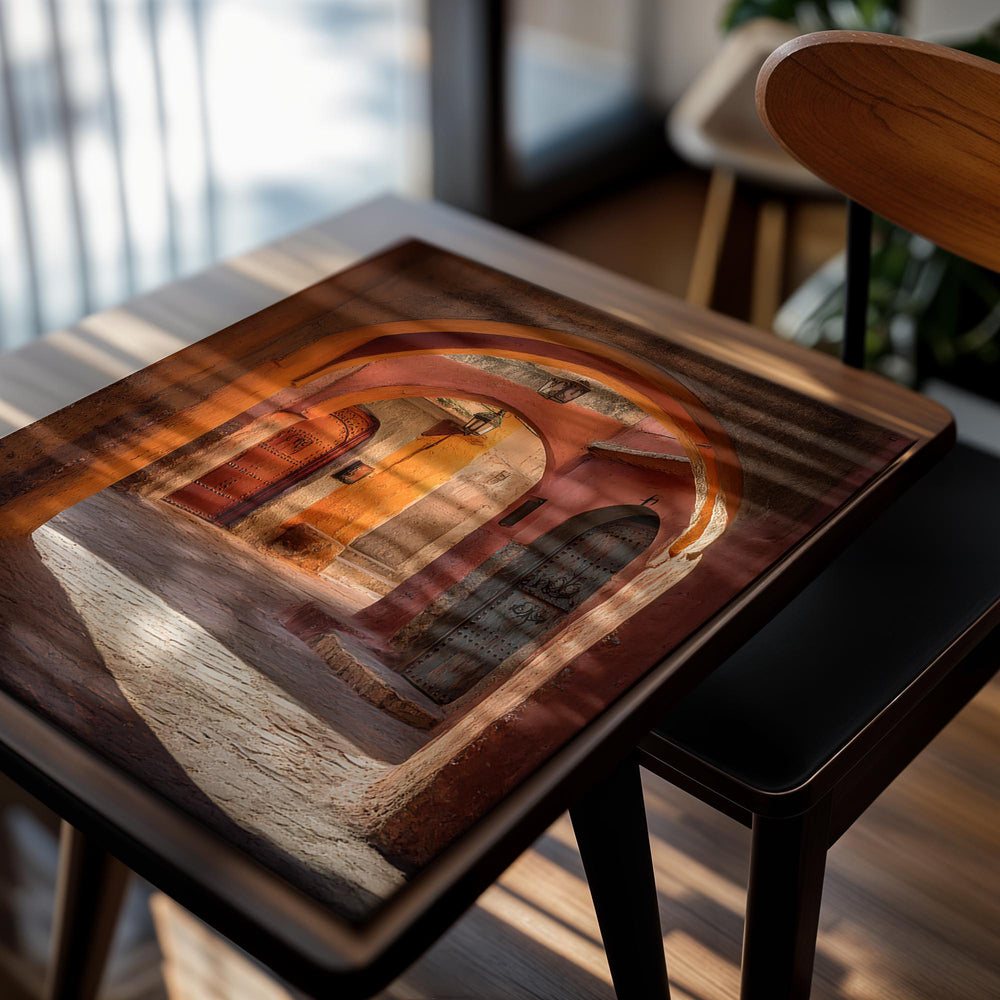 Arched entrance to a sunlit alleyway with traditional architecture, as a premium aluminum metal print from GoMetalPrint.

