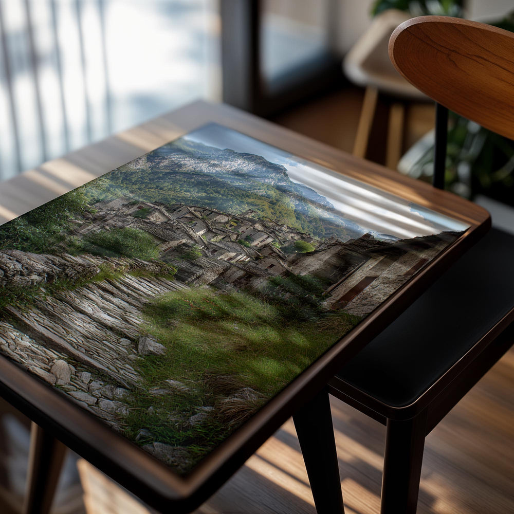 Stone path leading to an old village with mountains in the background, as a premium aluminum metal print from GoMetalPrint.
