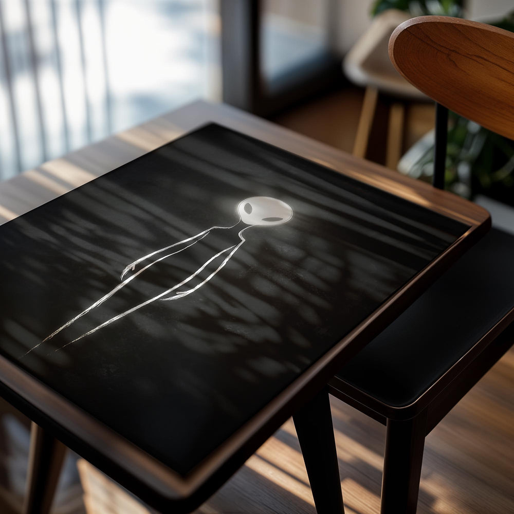 White silhouette of an alien on a black background, as a premium aluminum metal print from GoMetalPrint.
