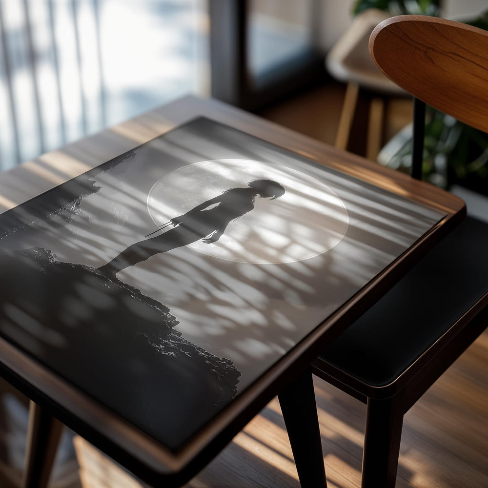 Silhouette of a person standing on a rock with a large moon in the background, as a premium aluminum metal print from GoMetalPrint.
