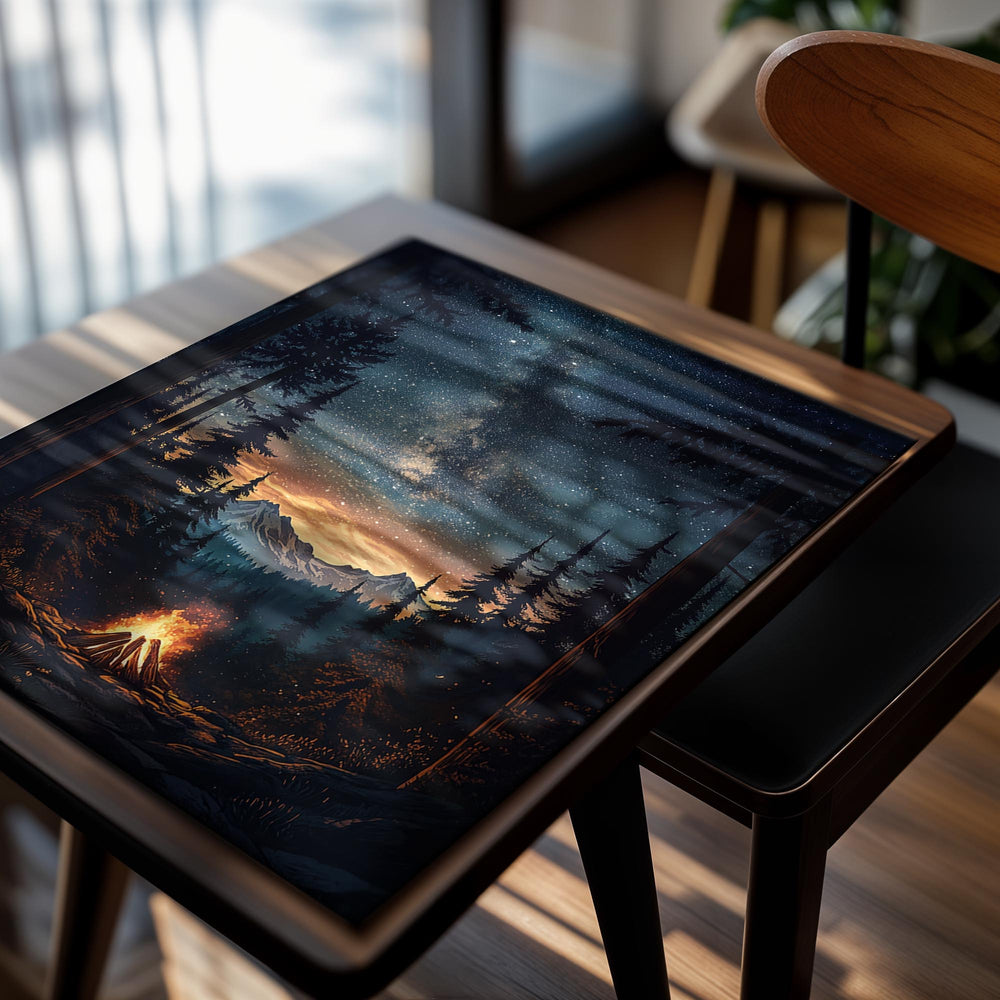 Campfire in a forest with stars and mountains in the background, as a premium aluminum metal print from GoMetalPrint.
