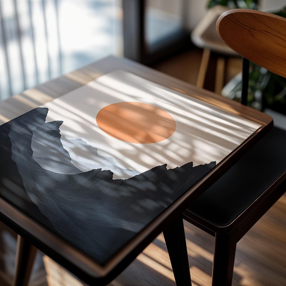 Surreal landscape with a large orange sun and dark mountains on a light pink background, as a premium aluminum metal print from GoMetalPrint.
