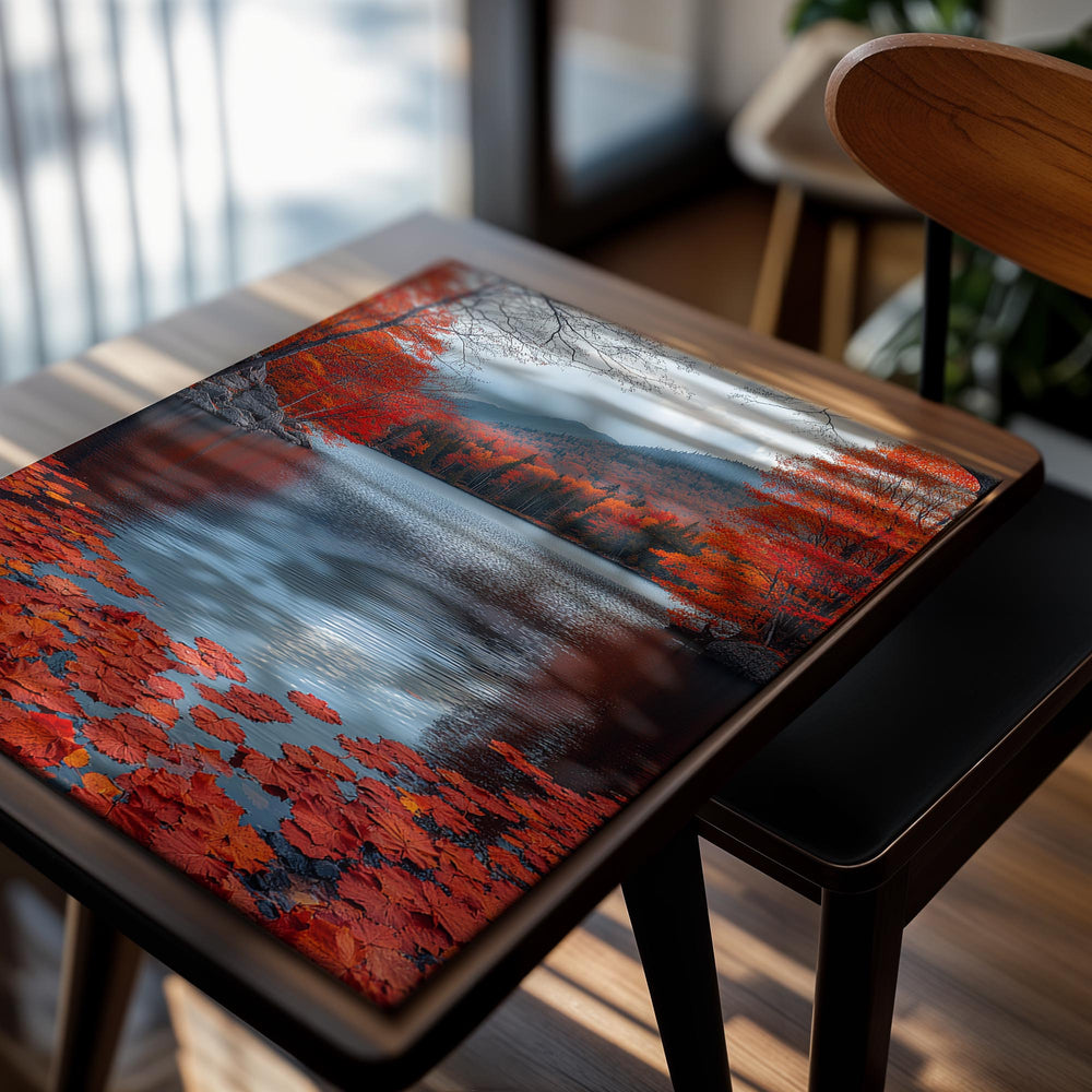 Autumn scene with red leaves floating on a lake surrounded by trees, as a premium aluminum metal print from GoMetalPrint.
