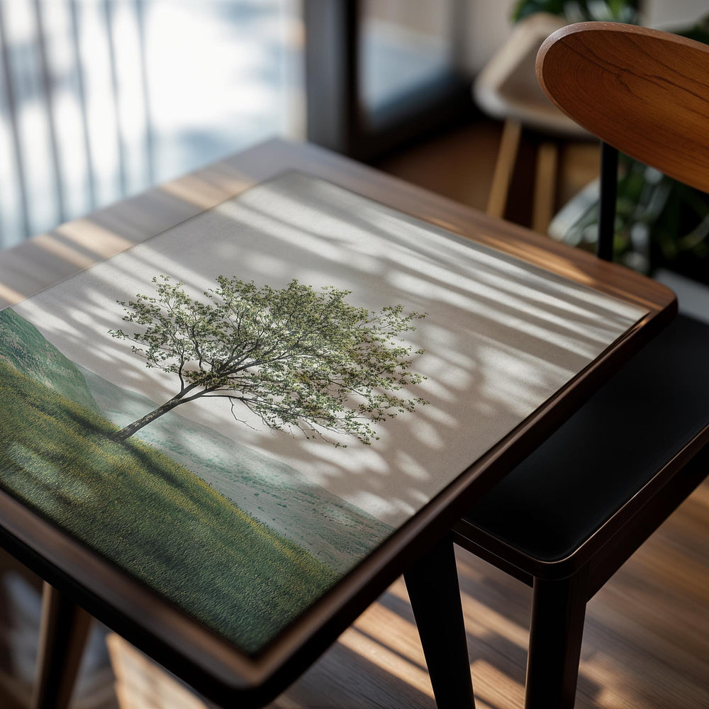 Single tree in a field with a landscape in the background, as a premium aluminum metal print from GoMetalPrint.

