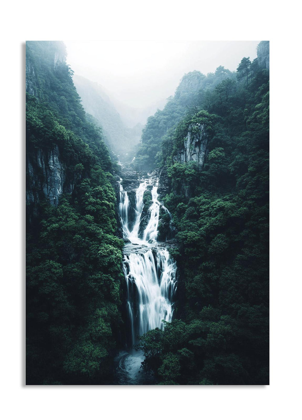 Waterfall in a lush green forest with misty atmosphere, as a premium aluminum metal print from GoMetalPrint.
