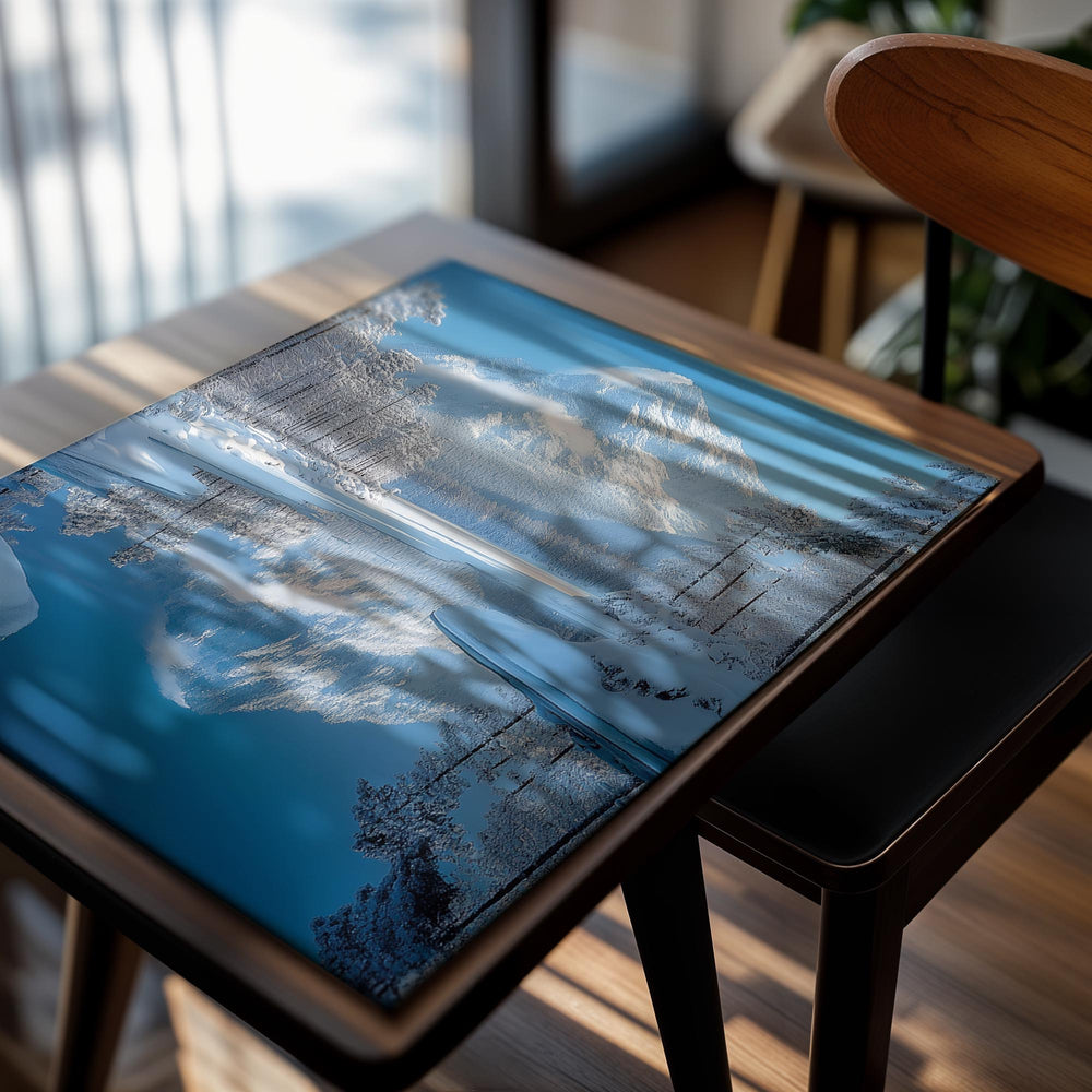 Snow-covered mountain reflected in a calm lake with trees on a clear day, as a premium aluminum metal print from GoMetalPrint.
