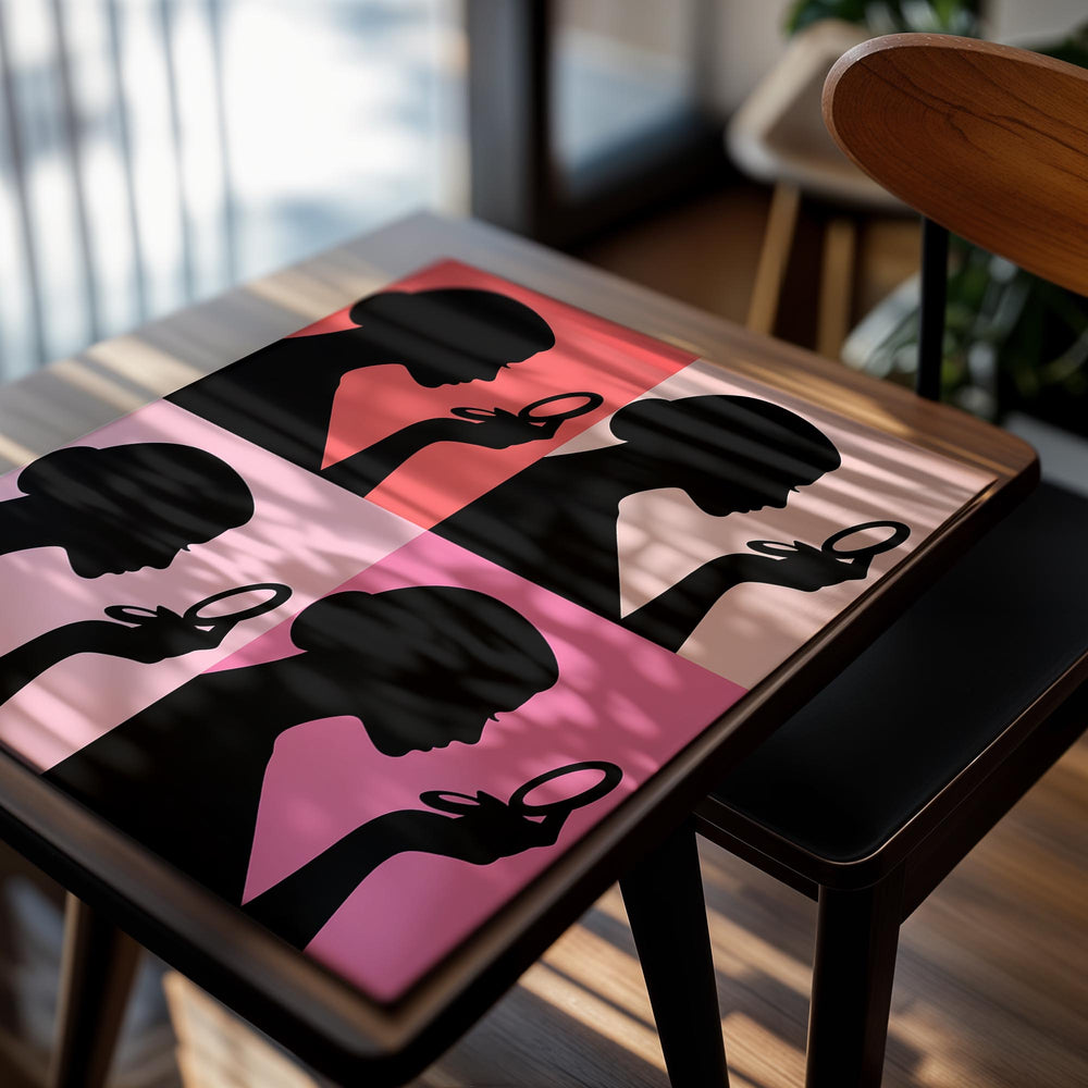 Silhouette of a woman holding a mirror against a pink and red background, as a premium aluminum metal print from GoMetalPrint.
